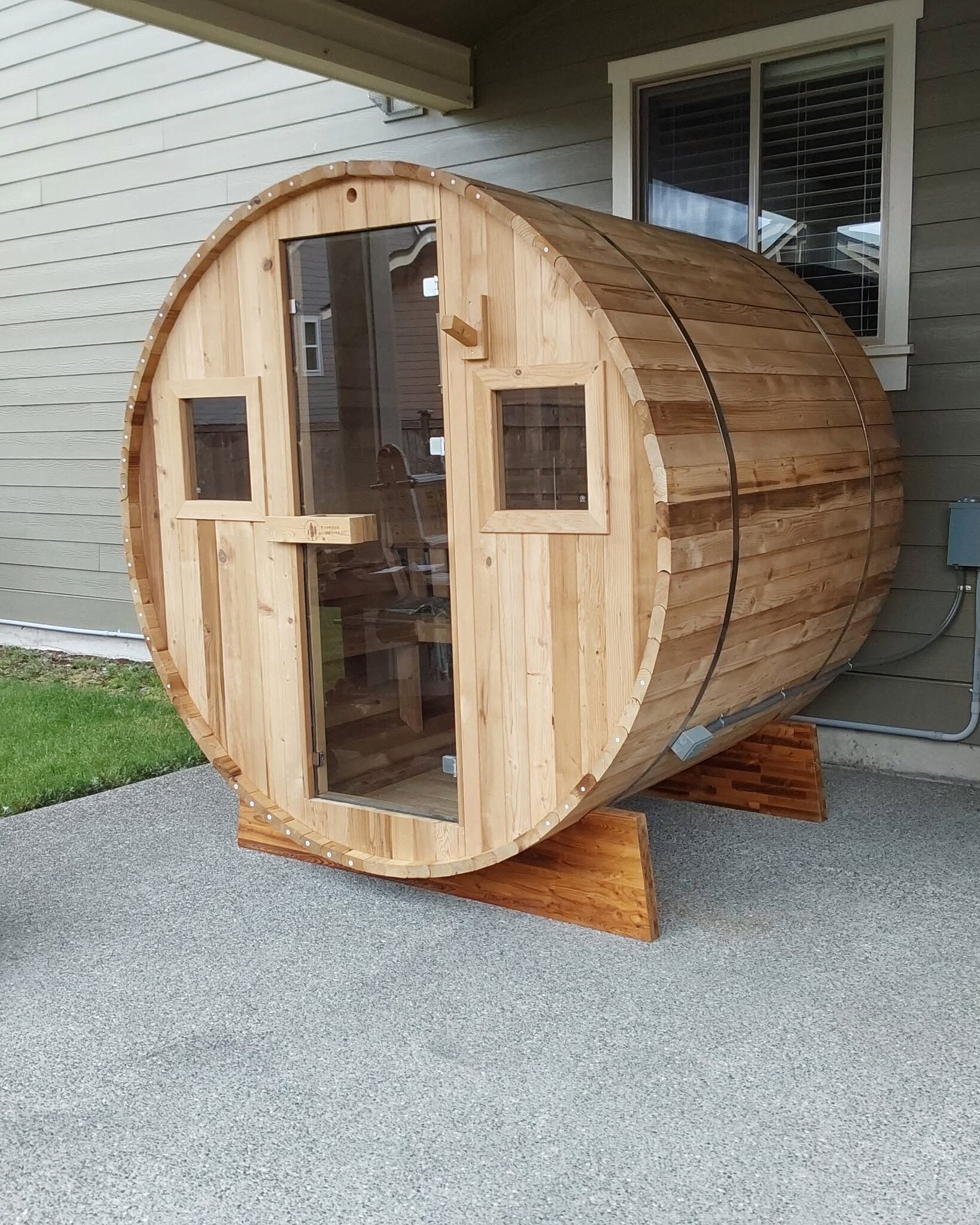 Modern outdoor sauna with professionally installed electrical wiring in a residential backyard in Graham, WA.